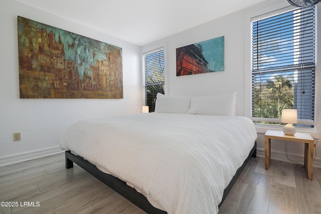 bedroom with hardwood / wood-style flooring