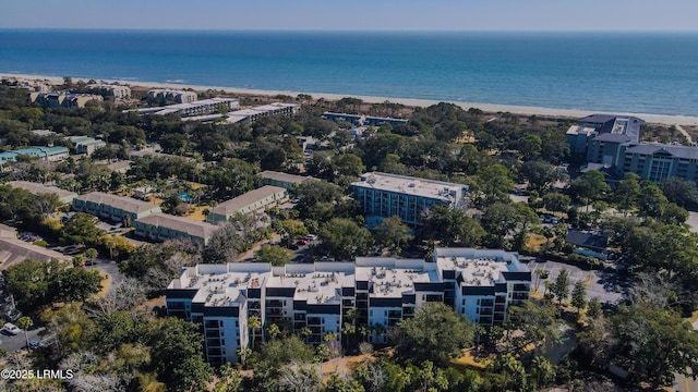 bird's eye view featuring a water view and a beach view