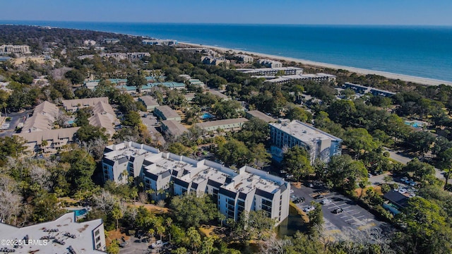 drone / aerial view featuring a water view and a beach view