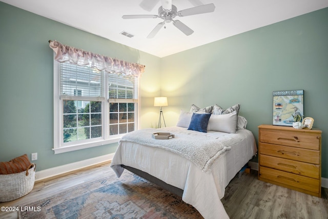 bedroom featuring wood-type flooring and ceiling fan