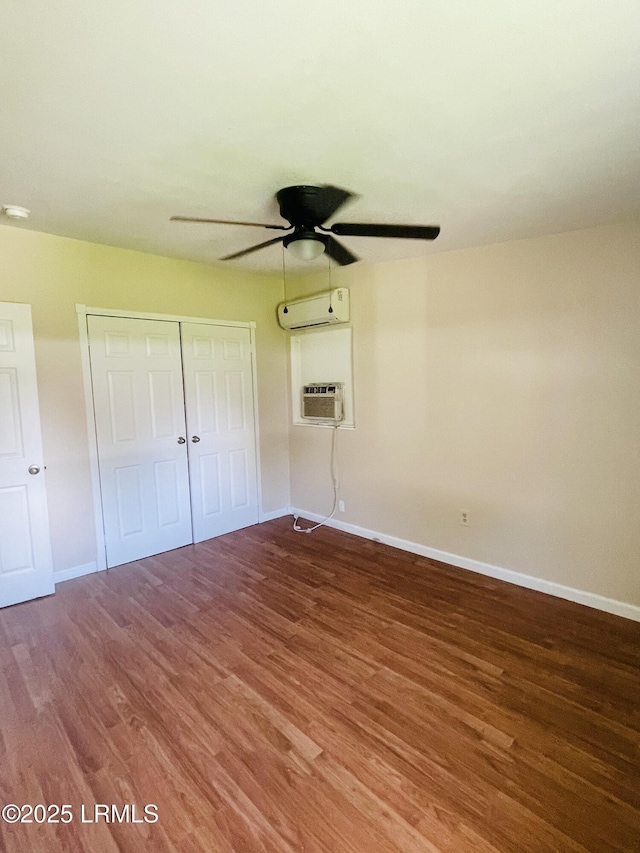 3005 Shell Point Rd, Beaufort, SC 29906 - unfurnished bedroom featuring an AC wall unit, wood finished floors, a closet, and a wall mounted air conditioner