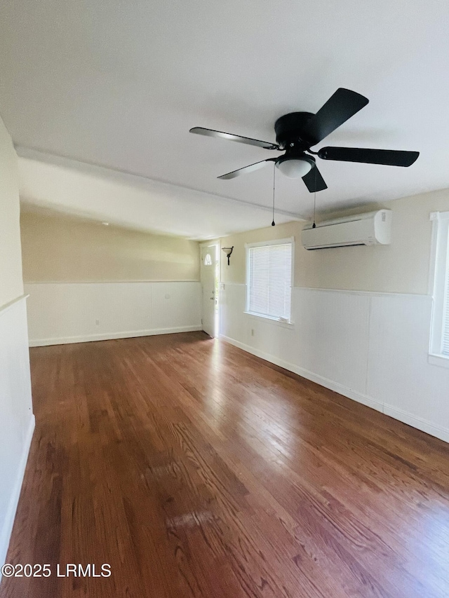 3005 Shell Point Rd, Beaufort, SC 29906 - unfurnished room featuring an AC wall unit, ceiling fan, wood finished floors, and wainscoting