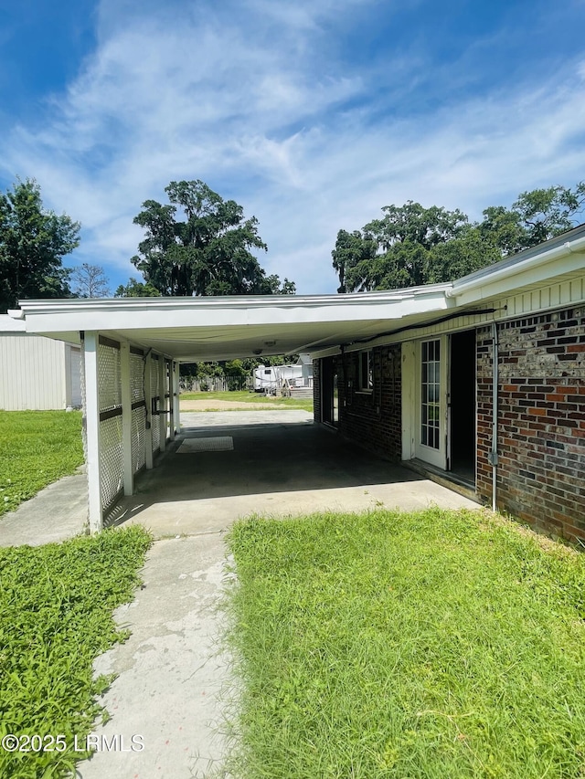 3005 Shell Point Rd, Beaufort, SC 29906 - view of vehicle parking featuring an attached carport and driveway