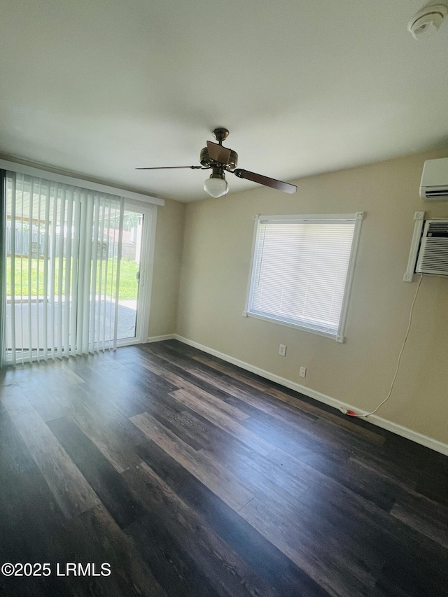 3005 Shell Point Rd, Beaufort, SC 29906 - empty room featuring dark wood-style floors, a ceiling fan, a wall mounted air conditioner, a smoke detector, and an AC wall unit