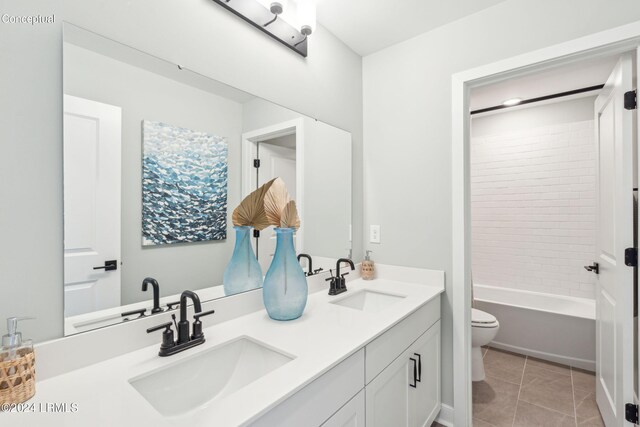 full bathroom featuring vanity, tiled shower / bath, tile patterned floors, and toilet