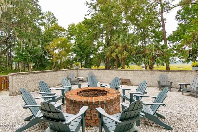 view of patio / terrace featuring an outdoor fire pit