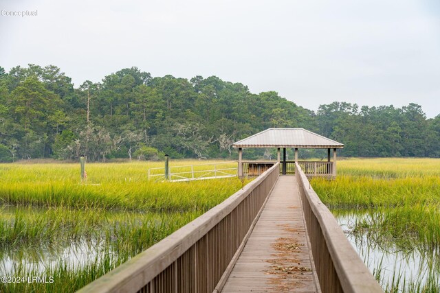 view of dock featuring a gazebo and a water view