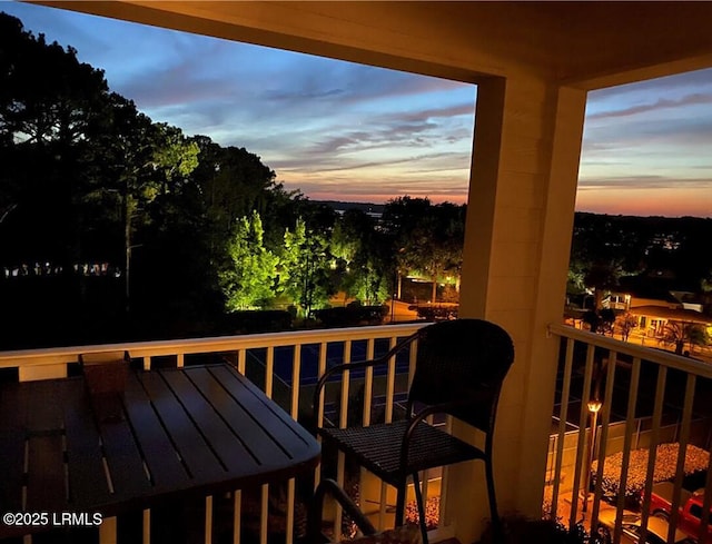 663 William Hilton Pkwy Unit 442, Hilton Head Island, SC 29928 - balcony at dusk featuring outdoor dining area