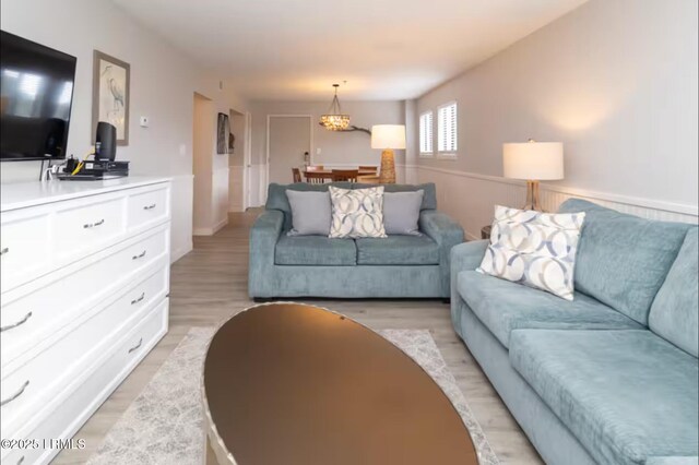 663 William Hilton Pkwy Unit 442, Hilton Head Island, SC 29928 - living room featuring light wood-style flooring and a chandelier