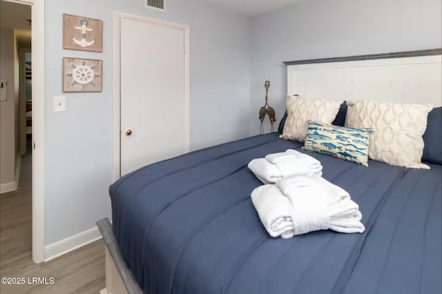 663 William Hilton Pkwy Unit 442, Hilton Head Island, SC 29928 - bedroom with baseboards and wood finished floors
