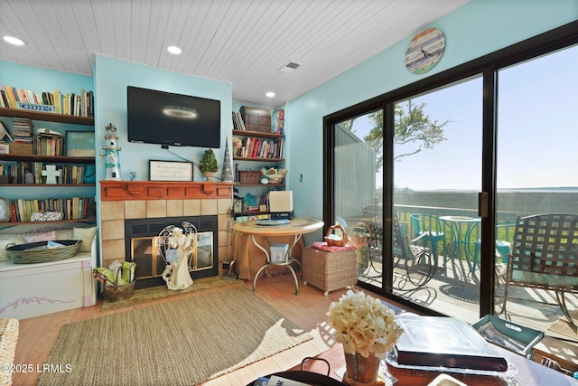 31 Anchorage Pt Unit 31, Hilton Head Island, SC 29928 - living area featuring wooden ceiling, wood finished floors, a tile fireplace, and recessed lighting