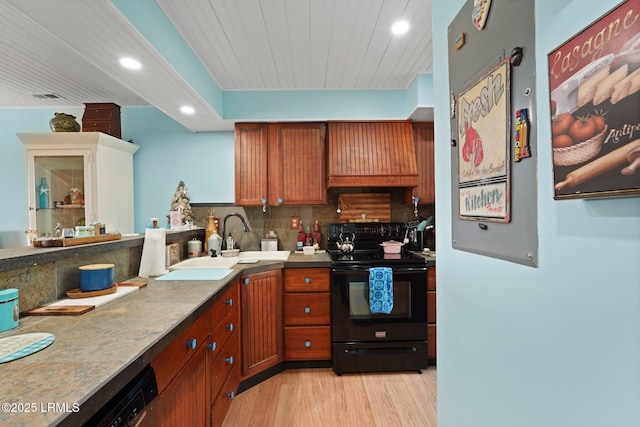 31 Anchorage Pt Unit 31, Hilton Head Island, SC 29928 - kitchen featuring tasteful backsplash, recessed lighting, light wood-style floors, black electric range oven, and custom range hood