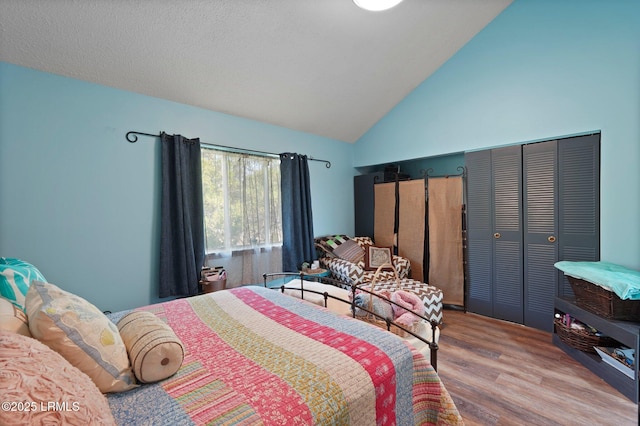 31 Anchorage Pt Unit 31, Hilton Head Island, SC 29928 - bedroom featuring wood finished floors and high vaulted ceiling
