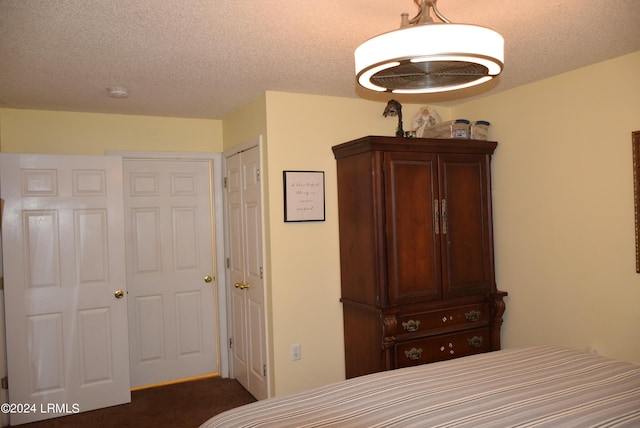 bedroom featuring a textured ceiling