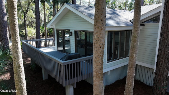 wooden terrace featuring a sunroom