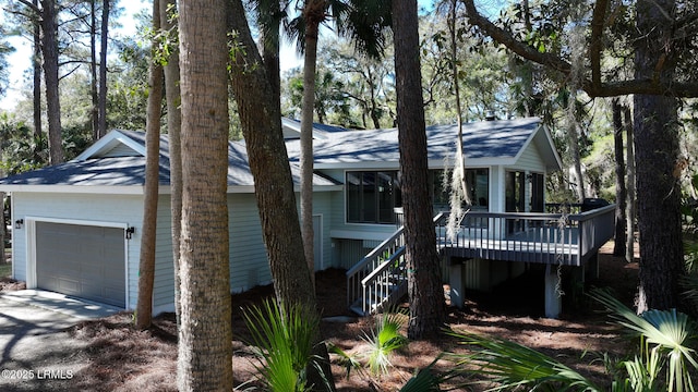view of front of house with stairs and a deck