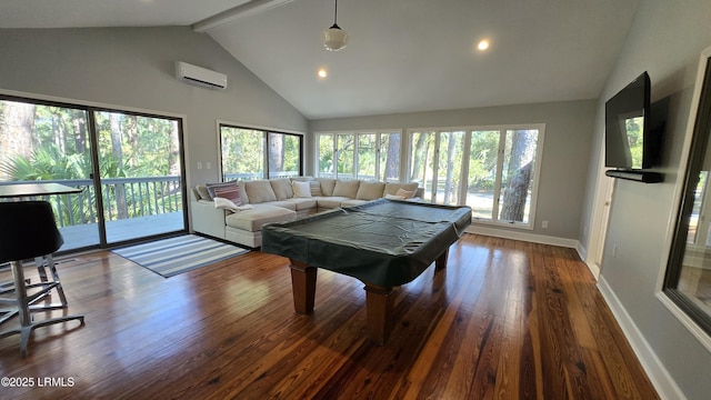 recreation room featuring plenty of natural light, a wall mounted air conditioner, wood finished floors, and baseboards