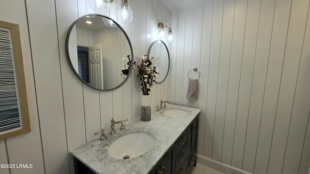 bathroom featuring double vanity and a sink