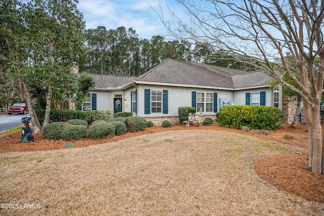 ranch-style home with a front yard