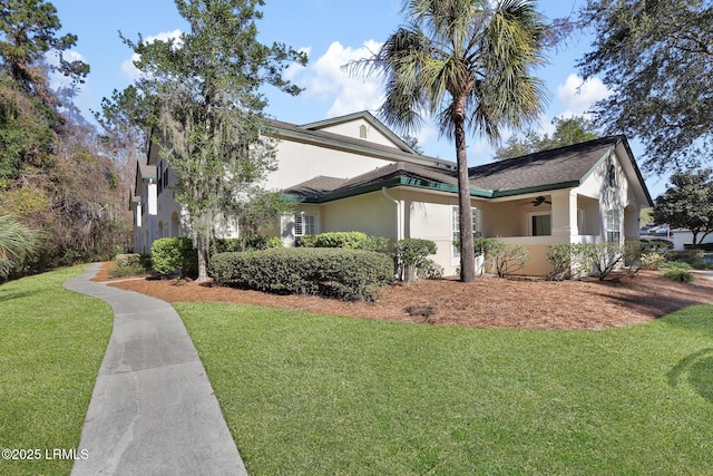 view of front of property featuring a front yard and stucco siding