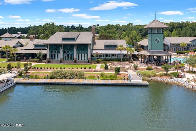 back of property with a water view