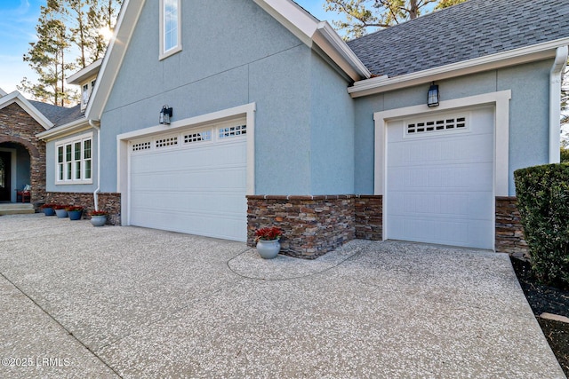 view of side of home with a garage