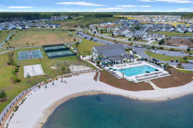 birds eye view of property with a water view