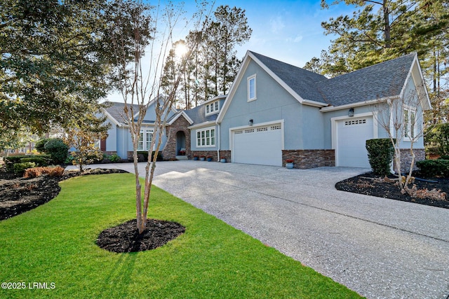 view of front facade with a garage and a front lawn