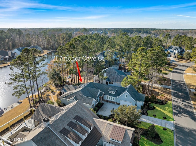 bird's eye view with a water view