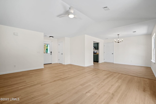 7 Grandiflora Ln, Beaufort, SC 29907 - unfurnished living room featuring a chandelier, lofted ceiling, ceiling fan, light wood-type flooring, and baseboards