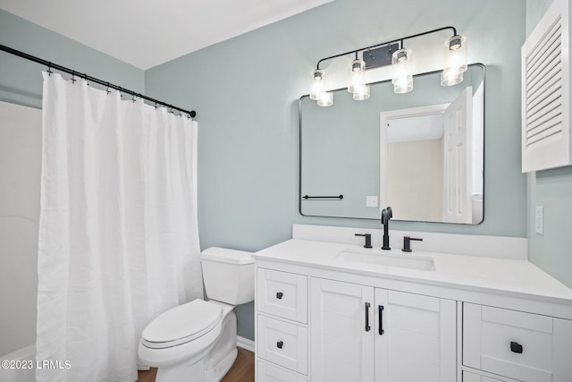 7 Grandiflora Ln, Beaufort, SC 29907 - full bath with toilet, vanity, wood finished floors, curtained shower, and baseboards