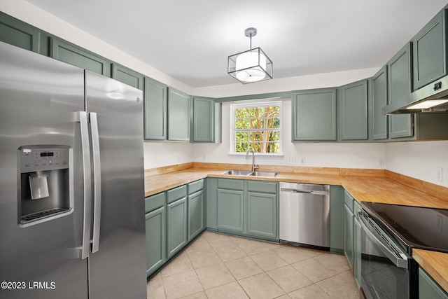 7 Grandiflora Ln, Beaufort, SC 29907 - kitchen with appliances with stainless steel finishes, a sink, butcher block countertops, and green cabinets