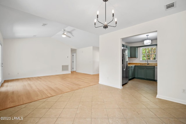 7 Grandiflora Ln, Beaufort, SC 29907 - unfurnished living room featuring vaulted ceiling, a chandelier, light tile patterned flooring, ceiling fan, and baseboards