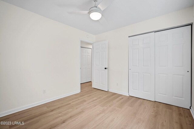 7 Grandiflora Ln, Beaufort, SC 29907 - unfurnished bedroom featuring light wood-style floors, baseboards, a closet, and a ceiling fan