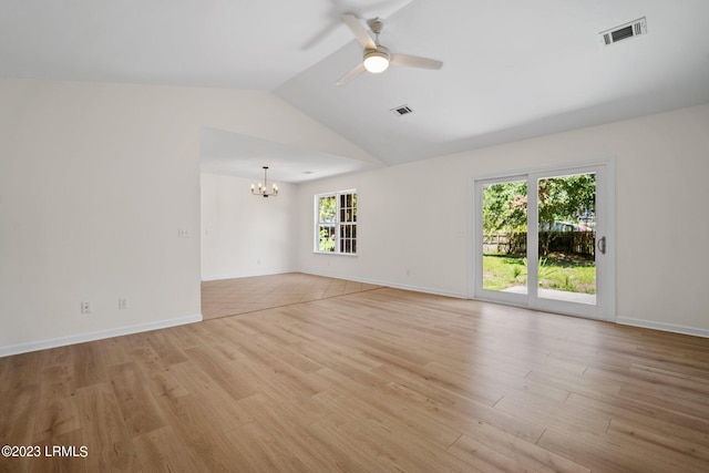 7 Grandiflora Ln, Beaufort, SC 29907 - spare room with a chandelier, light wood finished floors, vaulted ceiling, a ceiling fan, and baseboards