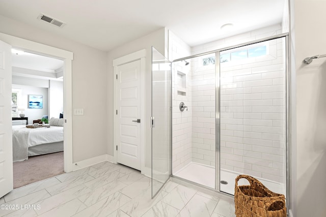 ensuite bathroom with marble finish floor, ensuite bath, visible vents, and a shower stall