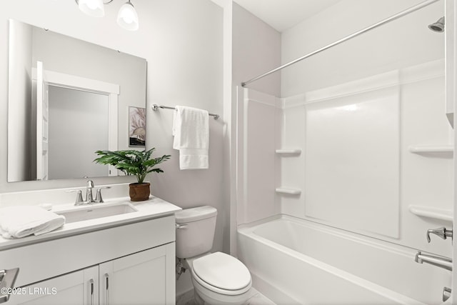 bathroom with toilet, washtub / shower combination, and vanity