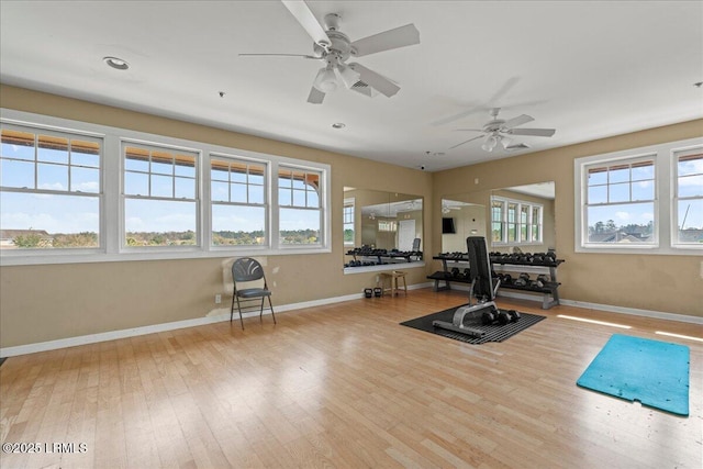 workout area featuring recessed lighting, wood finished floors, and baseboards