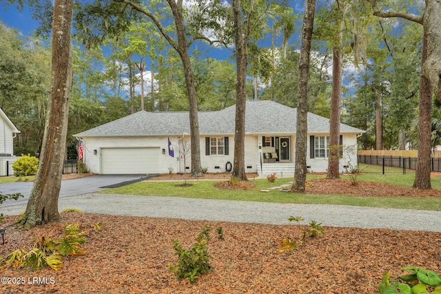 ranch-style house with a garage and a front yard