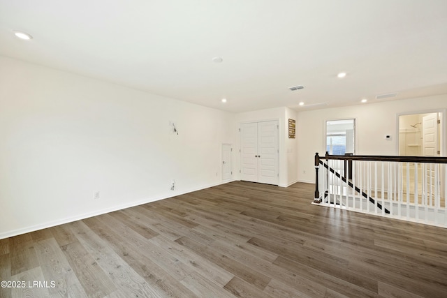 empty room with wood-type flooring