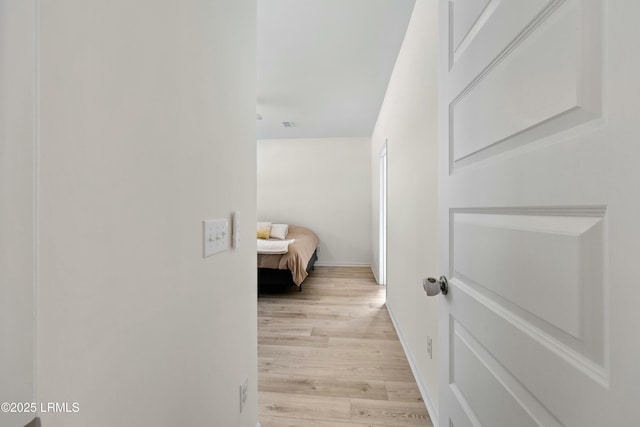 hallway with light wood-type flooring