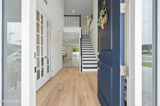 foyer featuring french doors and light wood-type flooring