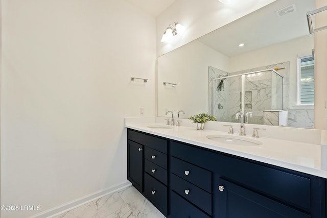 bathroom featuring vanity and a shower with door