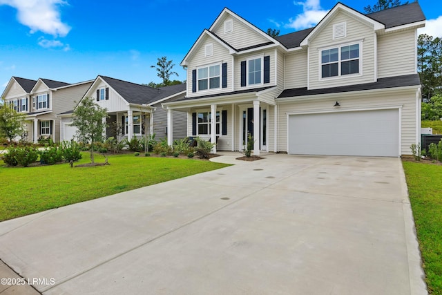 view of front of home featuring a garage, covered porch, and a front yard