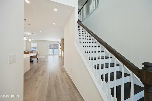 stairs with hardwood / wood-style floors