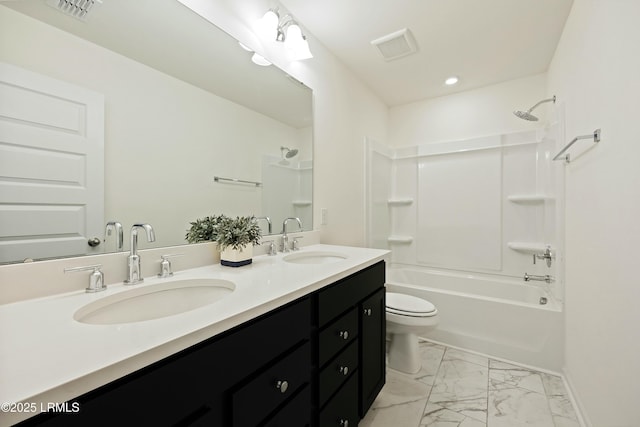 full bathroom with vanity, bathtub / shower combination, and toilet