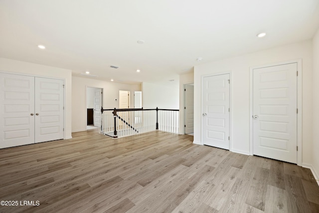 unfurnished room featuring light hardwood / wood-style flooring