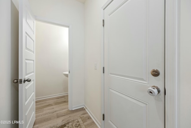 corridor featuring light hardwood / wood-style flooring