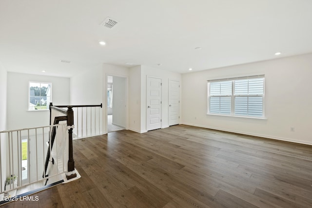 spare room with wood-type flooring