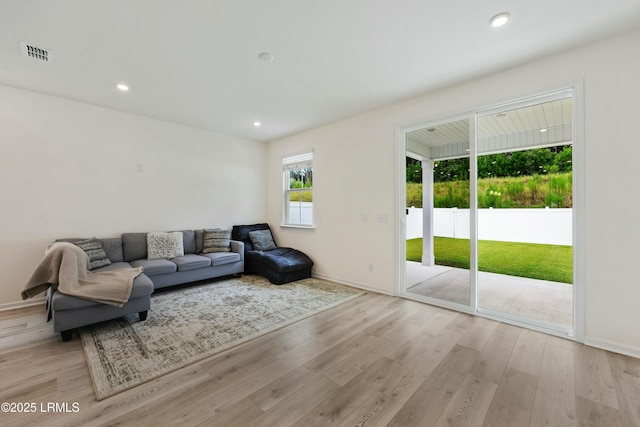 living room with light hardwood / wood-style flooring